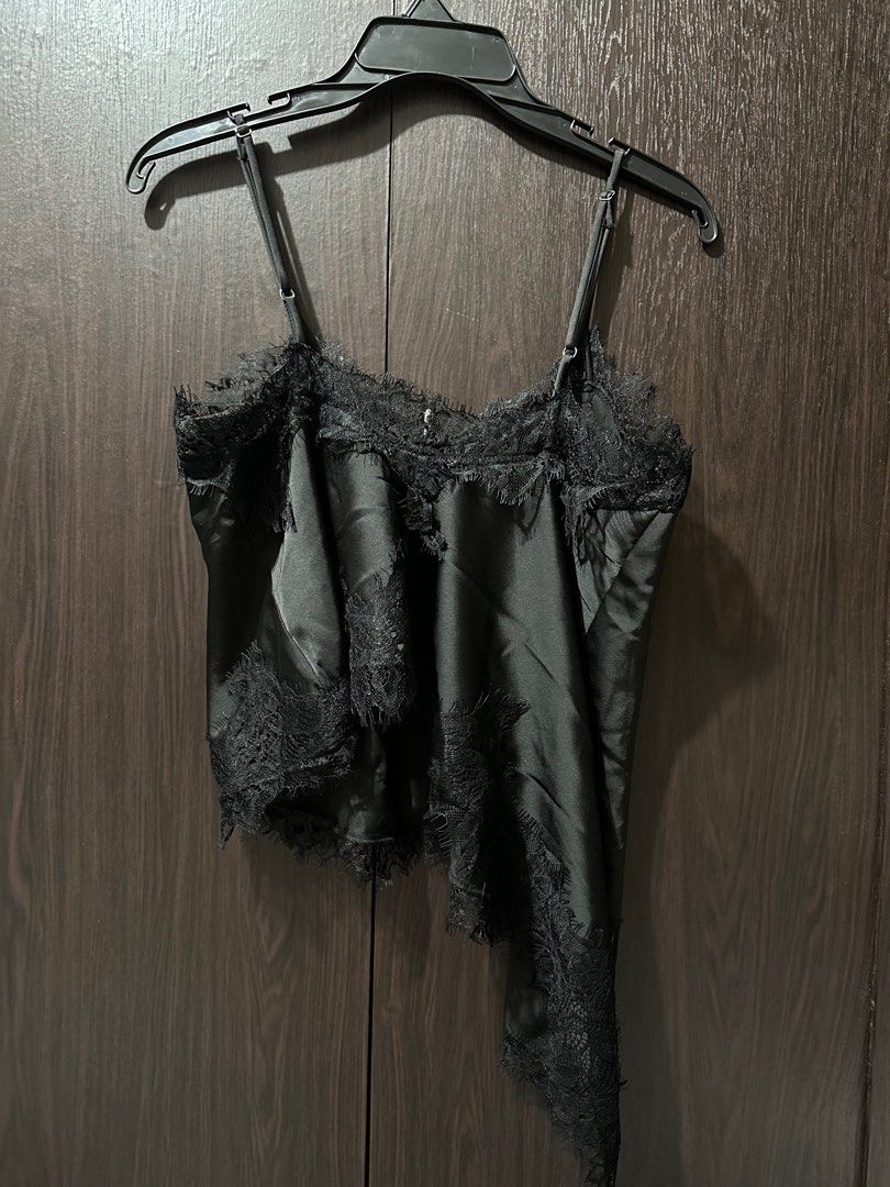 Black Satin Lace Trim Top (Category: Sleeveless) located in Makati City. Submitted by sohdeclutters_ (Listing ID 1437135238, Image 2). Description: - Black satin top - Delicate lace trim - Spaghetti straps - Asymmetrical hemline - Subtle sheen - Perfect for layering - Versatile for casual or dressy wear.