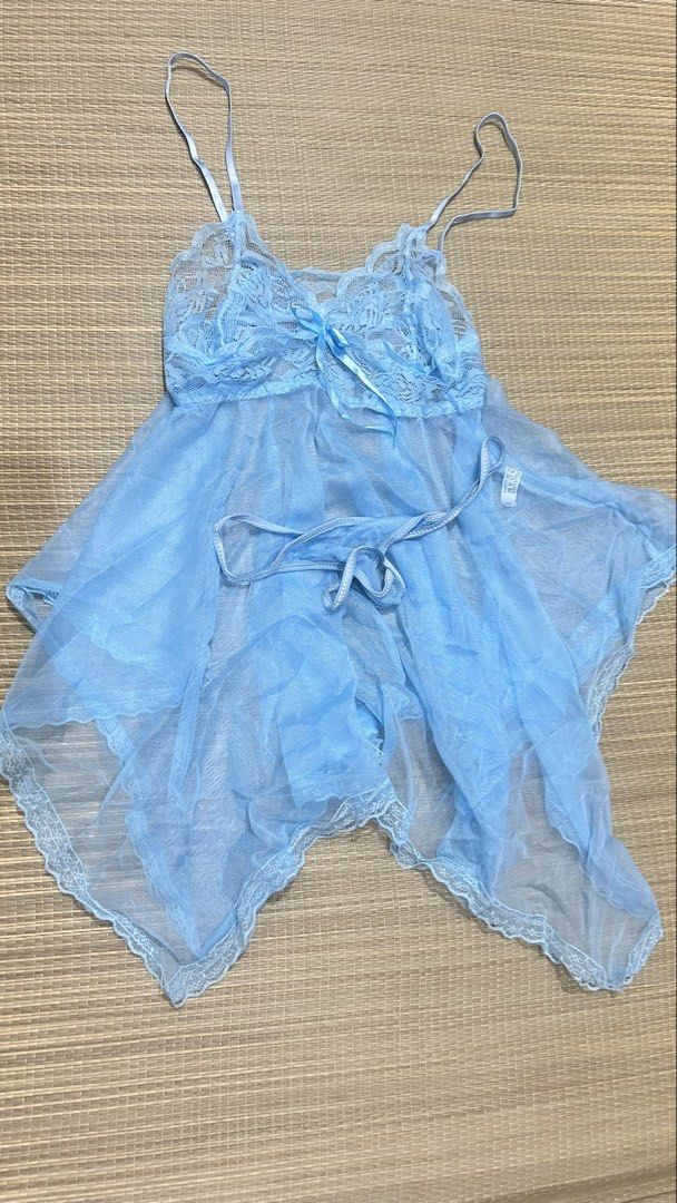 Blue Lace Lingerie Set (Category: Undergarments & Loungewear) located in Manila. Submitted by drip.chic_ (Listing ID 1437089056, Image 1). Description: - Color may vary due to lighting - Delicate blue lace lingerie set - Includes a top with adjustable straps and bow detail - Matching bottom included - Made of sheer, lightweight fabric.