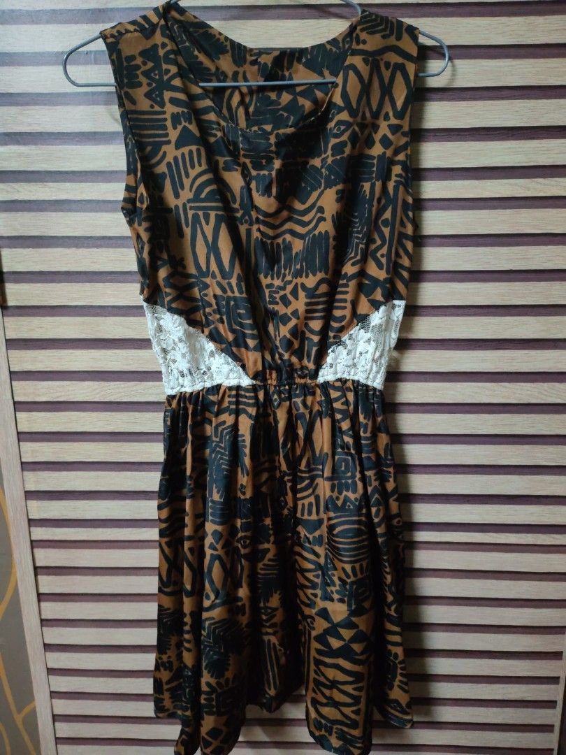 Brown and Black Patterned Dress with Lace (Category: Dresses) located in Makati City. Submitted by mybentables (Listing ID 1437152278, Image 1). Description: - Brown and black patterned dress - Sleeveless design - Fitted waist with white lace detail - Made of lightweight fabric - Perfect for warm weather - Can be dressed up or down -Tagged as free size because no size label on the dress when bought but can fit small to medium.