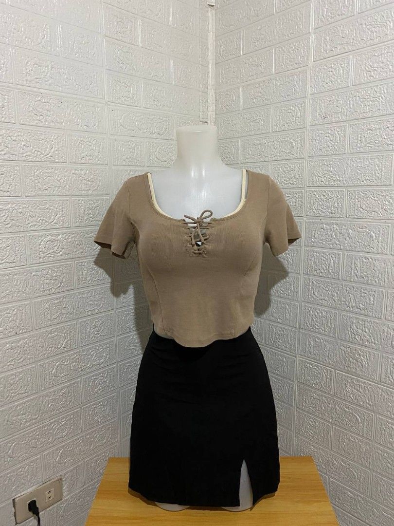 Brown Crop Top with Black Skirt Set (Category: Sets or Coordinates) located in Manila. Submitted by leshmode_ig (Listing ID 1437162942, Image 1). Description: - Brown crop top with square neckline and white trim. - Features a lace-up detail. - Black mini skirt with a side slit. - Great for casual or night out wear..