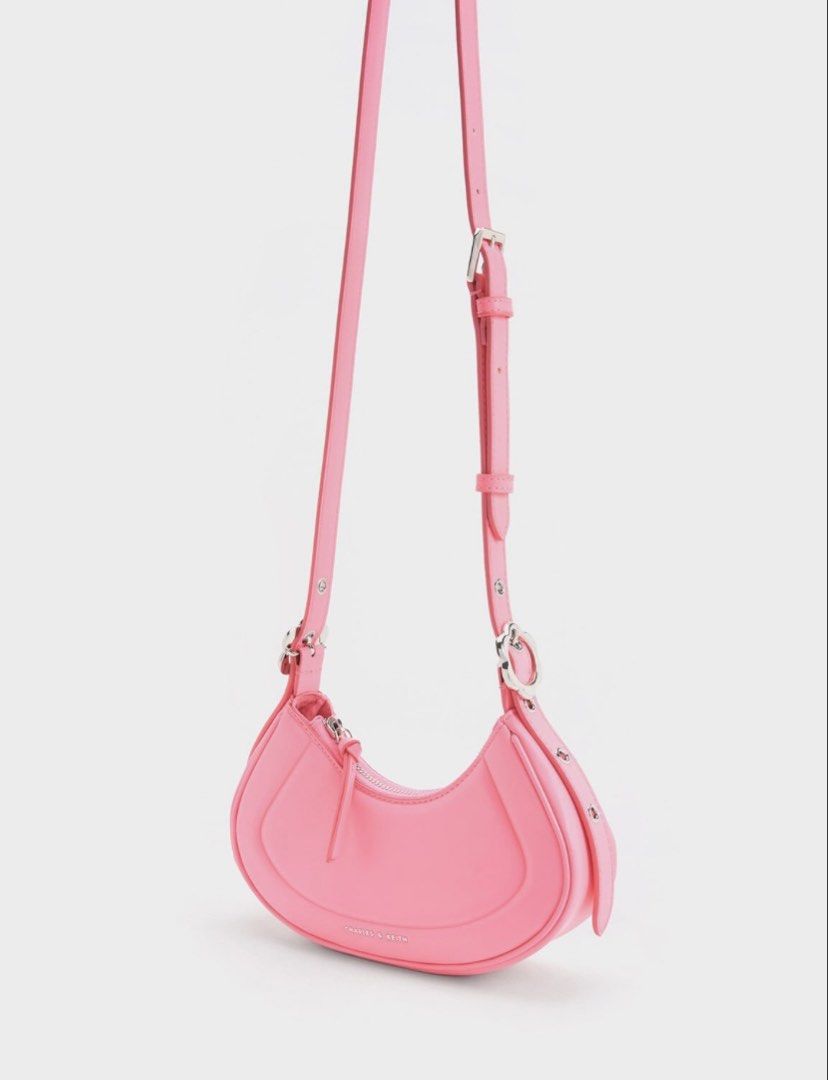 Charles & Keith Petra Curved Shoulder Bag (Category: Shoulder Bags) located in Manila. Submitted by lustrouselegance (Listing ID 1437078622, Image 2). Description: Zip closure Sculptural handle Comes with adjustable strap (detachable) Material: Faux leather Handle drop length (cm): 55 Depth (cm): 6 Width (cm): 23.5 Height (cm): 14.