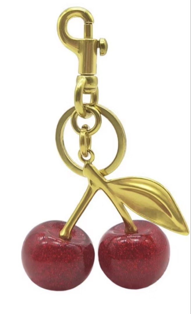 Cherry Keychain (Category: Charms) located in Manila. Submitted by stuffbyabby (Listing ID 1435818161, Image 1). Description: AVAILABLE AND LAST PRICE na. Low ballers will be ignored. If hindi afford, wag na mag inquire. Don’t waste time asking if available pa. It’s available as long as this post is not marked sold and interested buyers haven’t paid. RFS: Decluttering. - Not Coach brand - Deep red glittery cherry design - Gold-colored metal clip 