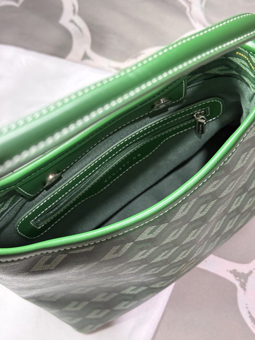 Christy Ng Green Small Shoulder Bag (Category: Shoulder Bags) located in Pasay City. Submitted by declutterbykz (Listing ID 1437115432, Image 2). Description: - Christy Ng shoulder bag -Used 5 times only -Bought at SM MEGAMALL CHRISTY NG OUTLET - Green handle - Includes dust bag and tags - Interior features a small pocket - Ideal size for daily use.