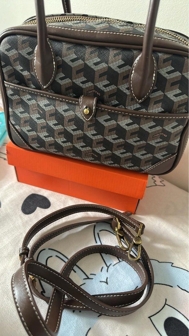 Christy Ng Marcelo in chestnut brown (Category: Luxury Bags & Wallets) located in Manila. Submitted by maryjoremf13085 (Listing ID 1437018792, Image 1). Description: Christy Ng Marcelo in chestnut brown No flaw but with signs of usage. Used. - Geometric pattern handbag - Top handle - Detachable shoulder strap - Front pocket - Gold-tone clasp.