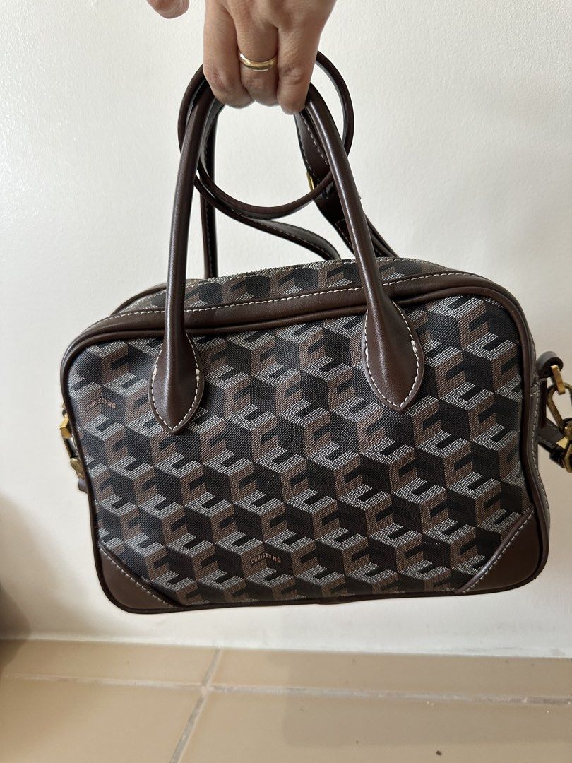 Christy Ng Marcelo in chestnut brown (Category: Luxury Bags & Wallets) located in Manila. Submitted by maryjoremf13085 (Listing ID 1437018792, Image 3). Description: Christy Ng Marcelo in chestnut brown No flaw but with signs of usage. Used. - Geometric pattern handbag - Top handle - Detachable shoulder strap - Front pocket - Gold-tone clasp.