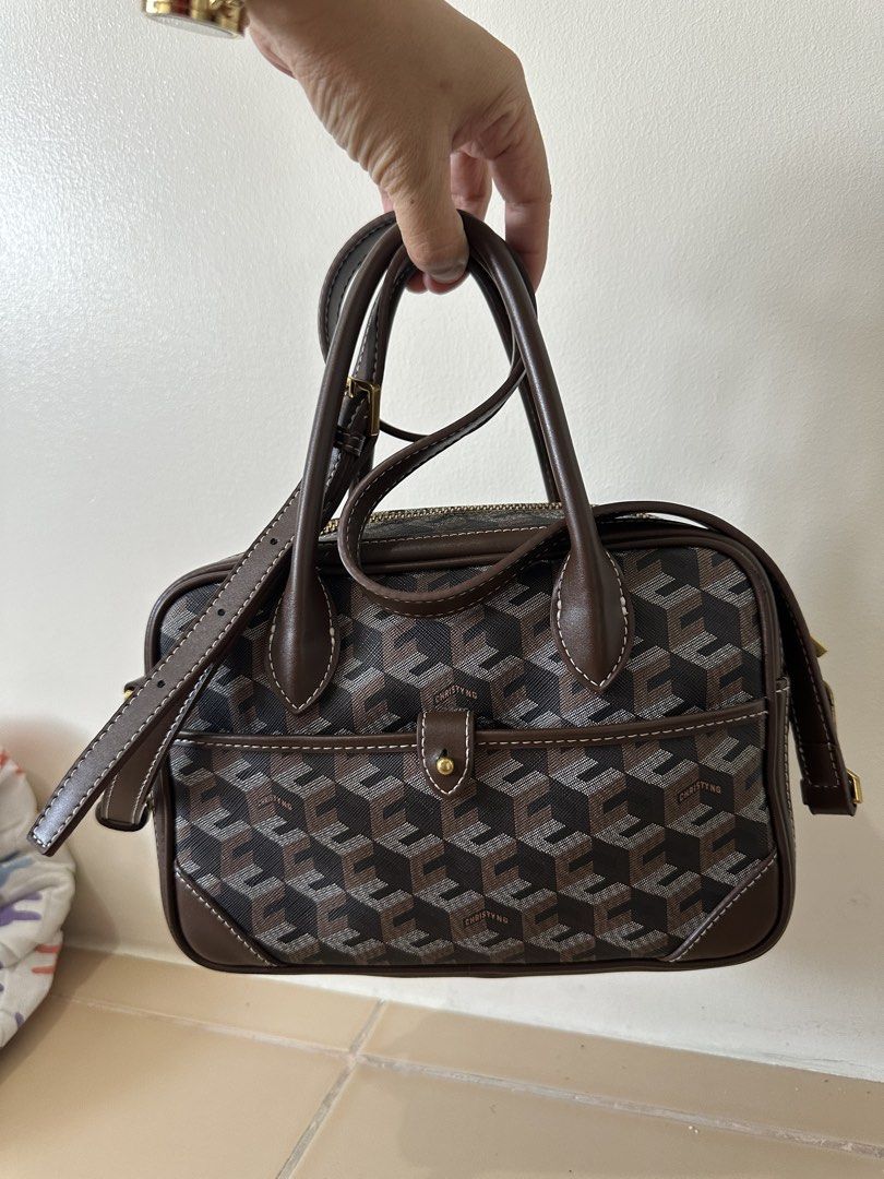 Christy Ng Marcelo in chestnut brown (Category: Luxury Bags & Wallets) located in Manila. Submitted by maryjoremf13085 (Listing ID 1437018792, Image 2). Description: Christy Ng Marcelo in chestnut brown No flaw but with signs of usage. Used. - Geometric pattern handbag - Top handle - Detachable shoulder strap - Front pocket - Gold-tone clasp.