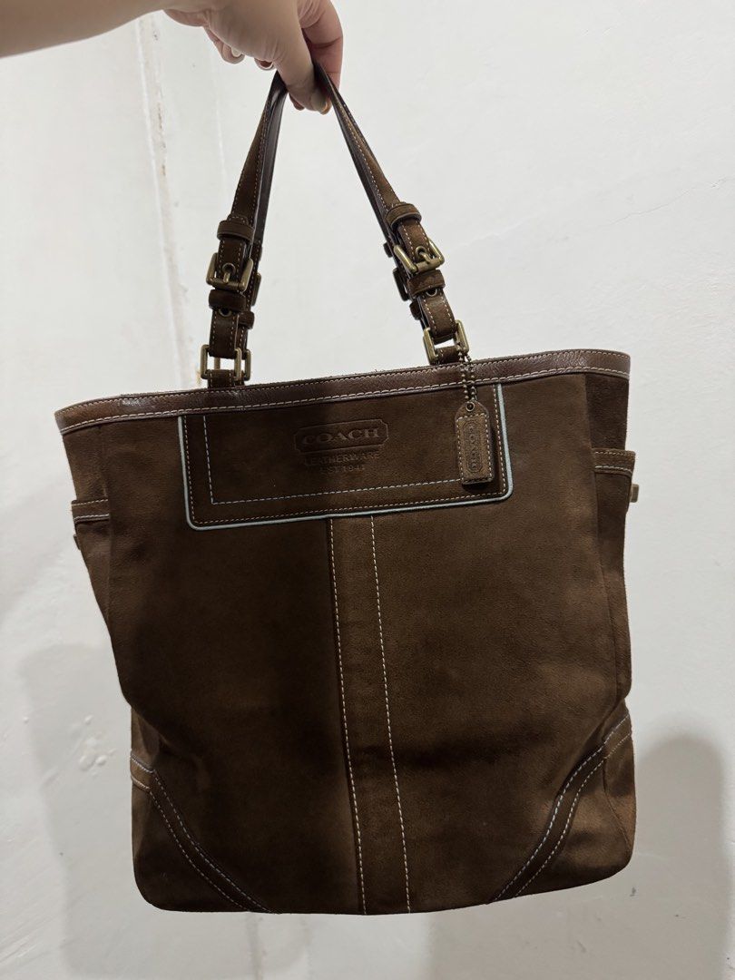 Coach Brown Suede Tote hand Bag (Category: Luxury Bags & Wallets) located in Taguig. Submitted by levinc (Listing ID 1437181492, Image 1). Description: - Coach brown suede tote bag - Dual top handles - Exterior side pockets - Leather trim - Includes Coach hangtag - Classic, structured design DM for more pics!.