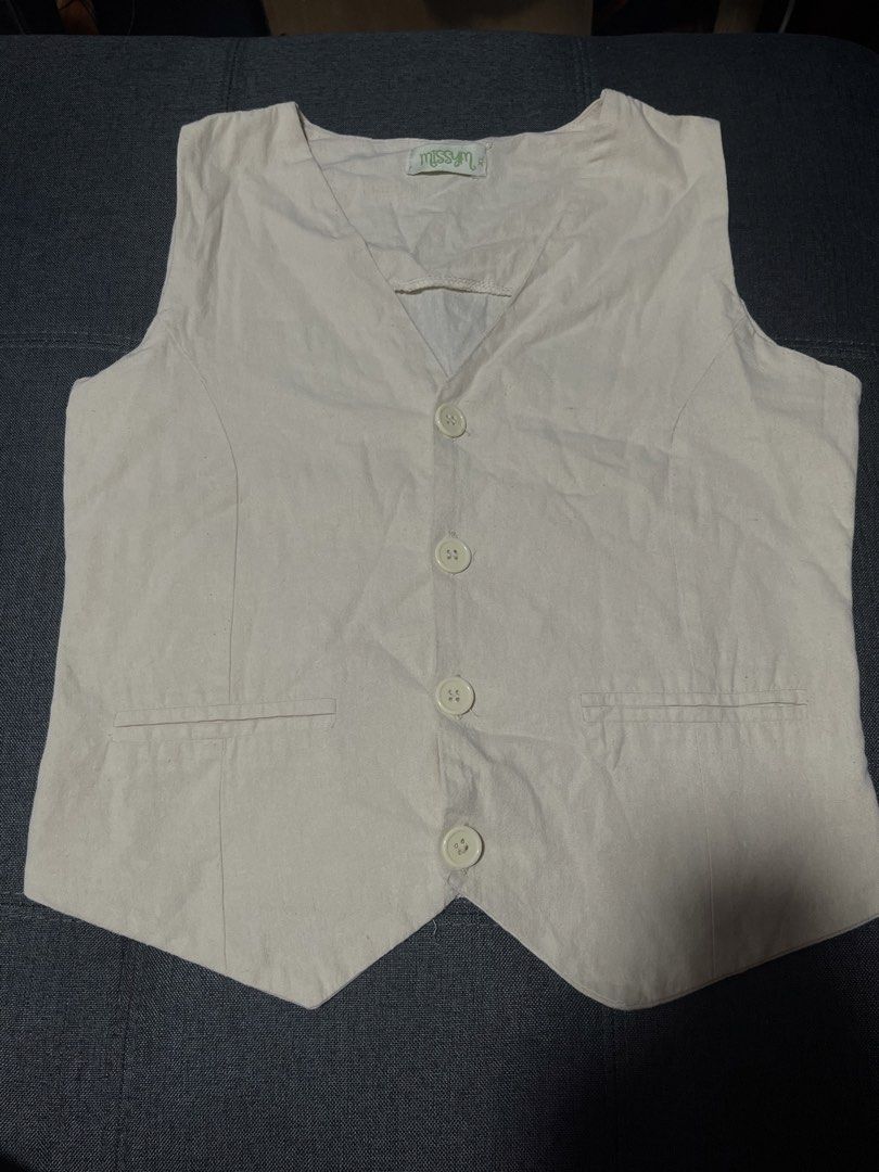 Cream Corporate / Office Vest (Category: Sleeveless) located in Marikina City. Submitted by d.clutters (Listing ID 1437089022, Image 1). Description: - Cream-colored vest - V-neck design - Button closure - Two front pockets - Lightweight fabric - Classic style - Corporate Vest - For office.