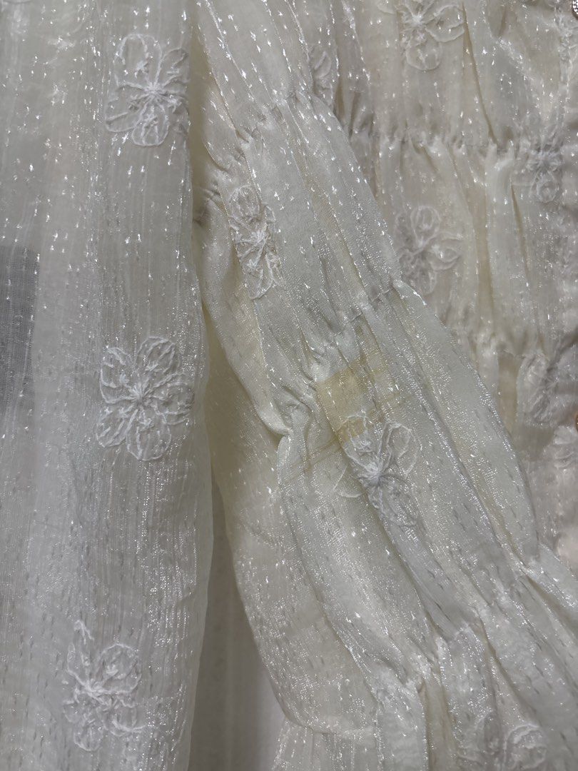 Cream Floral Embroidered Blouse (Category: Blouses) located in Manila. Submitted by kykynsss (Listing ID 1437054232, Image 3). Description: Preloved Fits SMALL -MEDIUM For courier pick up only at Brgy La Paz Makati City - Cream-colored blouse - Floral embroidery - Long sleeves - Ruffled collar - Button-down front with pearl-like buttons - Visible stain on sleeve - Lined.