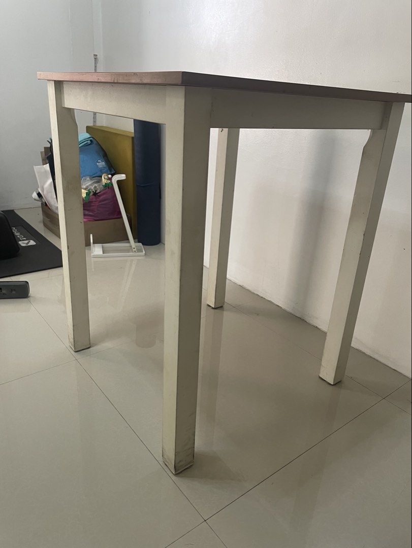 Dining Table (2 seater) (Category: Tables & Sets) located in Quezon City. Submitted by alex_bhc (Listing ID 1437077520, Image 1). Description: Selling used 2-seater dining table with visible signs of wear. No defects (hindi umuuga, no uneven legs). White legs and light-wash wood top. Price slightly negotiable, shipping care of buyer. Dimension: 60 cm*60 cm.
