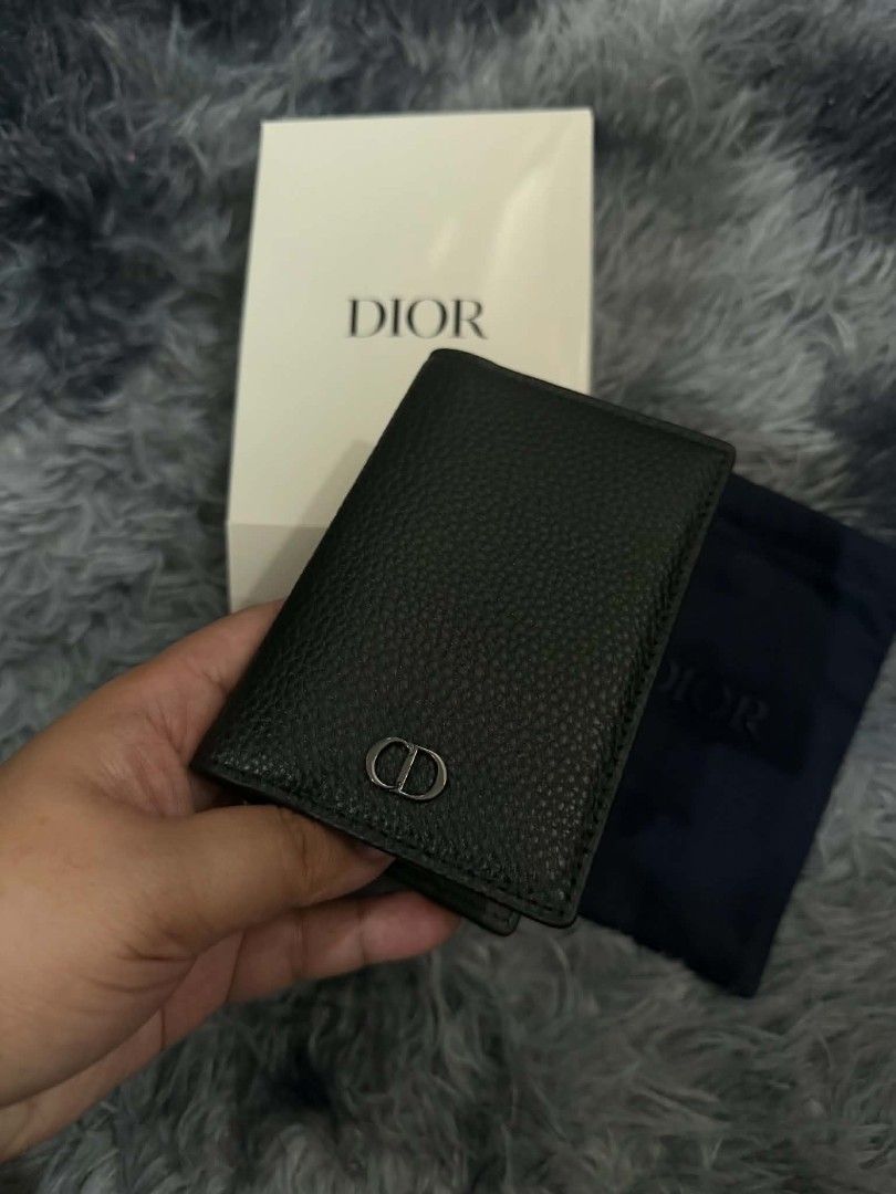 Dior Black Leather Card Case (Category: Luxury Bags & Wallets) located in Pasig City. Submitted by prettydarla (Listing ID 1437063149, Image 1). Description: - Authentic Dior complimentary from Dior Paris Parfum - Soft Calf Black leather - Features CD logo - New - Includes original box and dust bag.