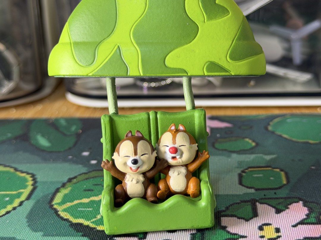 Disney Chip and Dale Figurine (Category: Figurines & Statues) located in Baguio. Submitted by jonathanseller_buyer (Listing ID 1437020202, Image 1). Description: - Adorable Chip and Dale figurine - Features Chip and Dale in a hot air balloon-like structure - Chip and Dale are seated with arms open - Green seat and camouflage pattern on top - Detailed design and vibrant colors.