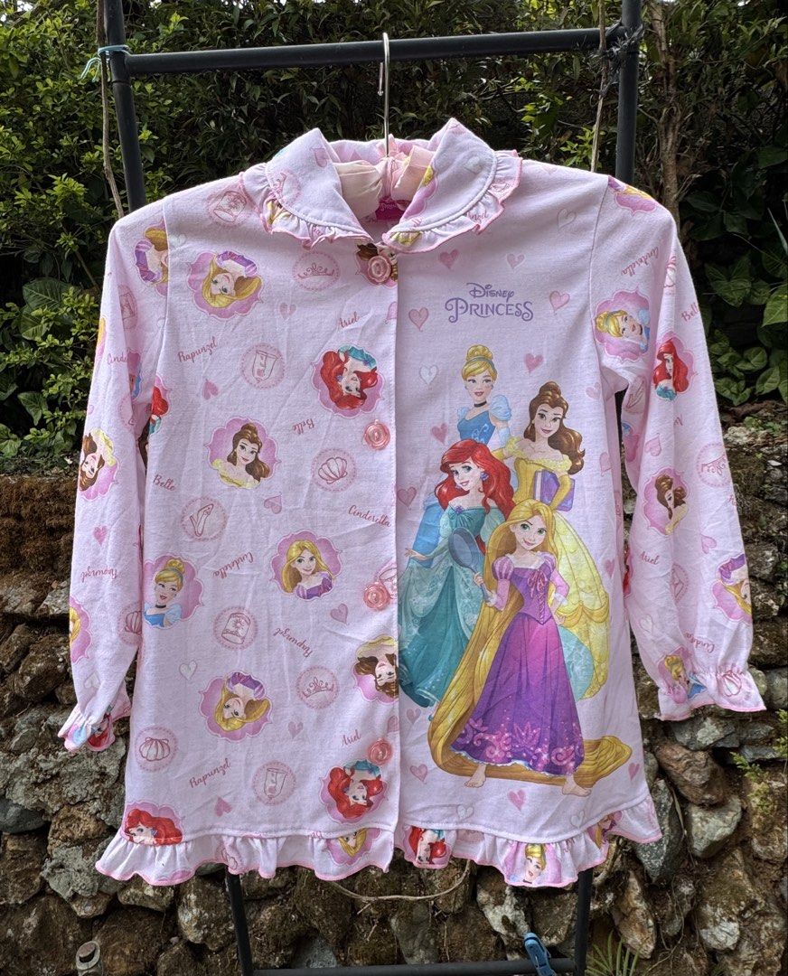 Disney Princess Pajamas Size 120 (Category: Babies & Kids Fashion) located in Baguio. Submitted by goodfindsbaguio (Listing ID 1437075202, Image 3). Description: - Adorable Disney Princess pajamas - Features Ariel, Belle, Cinderella, and Rapunzel - Pink color - Button-down front - Ruffled collar and hem - Size: 120 - Ideal for little girls.