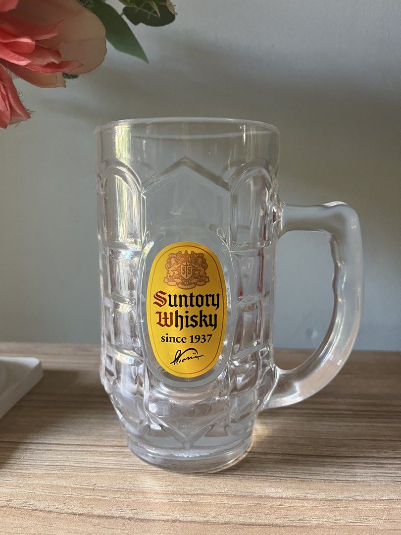 Japanese Extra Large Suntory Whisky Mug (Category: Coffee & Tea Tableware) located in Quezon City. Submitted by metamerchant (Listing ID 1437057540, Image 1). Description: - Suntory Whisky glass mug extra large size - diameter 9.2cm x height 17cm - Features the Suntory logo: "Suntory Whisky since 1937". - Includes a handle and textured design. - Perfect for your favorite beverage and barware collection. -Price slightly negotiable.