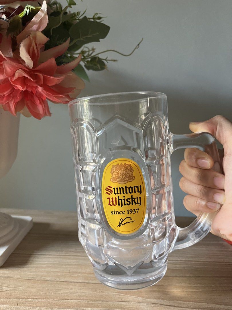 Japanese Extra Large Suntory Whisky Mug (Category: Coffee & Tea Tableware) located in Quezon City. Submitted by metamerchant (Listing ID 1437057540, Image 3). Description: - Suntory Whisky glass mug extra large size - diameter 9.2cm x height 17cm - Features the Suntory logo: "Suntory Whisky since 1937". - Includes a handle and textured design. - Perfect for your favorite beverage and barware collection. -Price slightly negotiable.