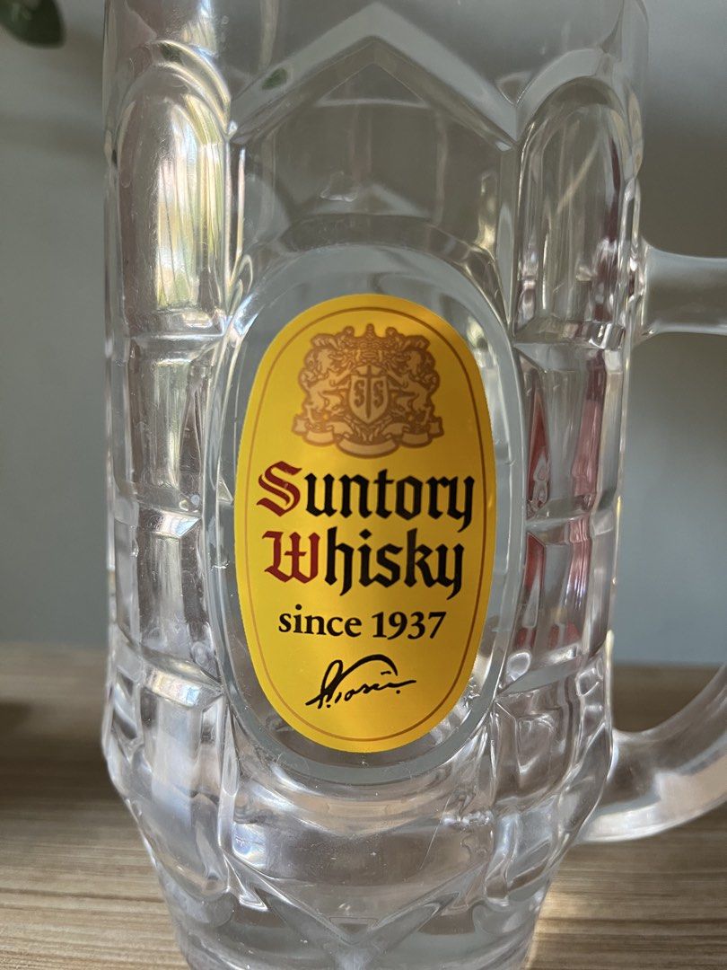 Japanese Extra Large Suntory Whisky Mug (Category: Coffee & Tea Tableware) located in Quezon City. Submitted by metamerchant (Listing ID 1437057540, Image 2). Description: - Suntory Whisky glass mug extra large size - diameter 9.2cm x height 17cm - Features the Suntory logo: "Suntory Whisky since 1937". - Includes a handle and textured design. - Perfect for your favorite beverage and barware collection. -Price slightly negotiable.