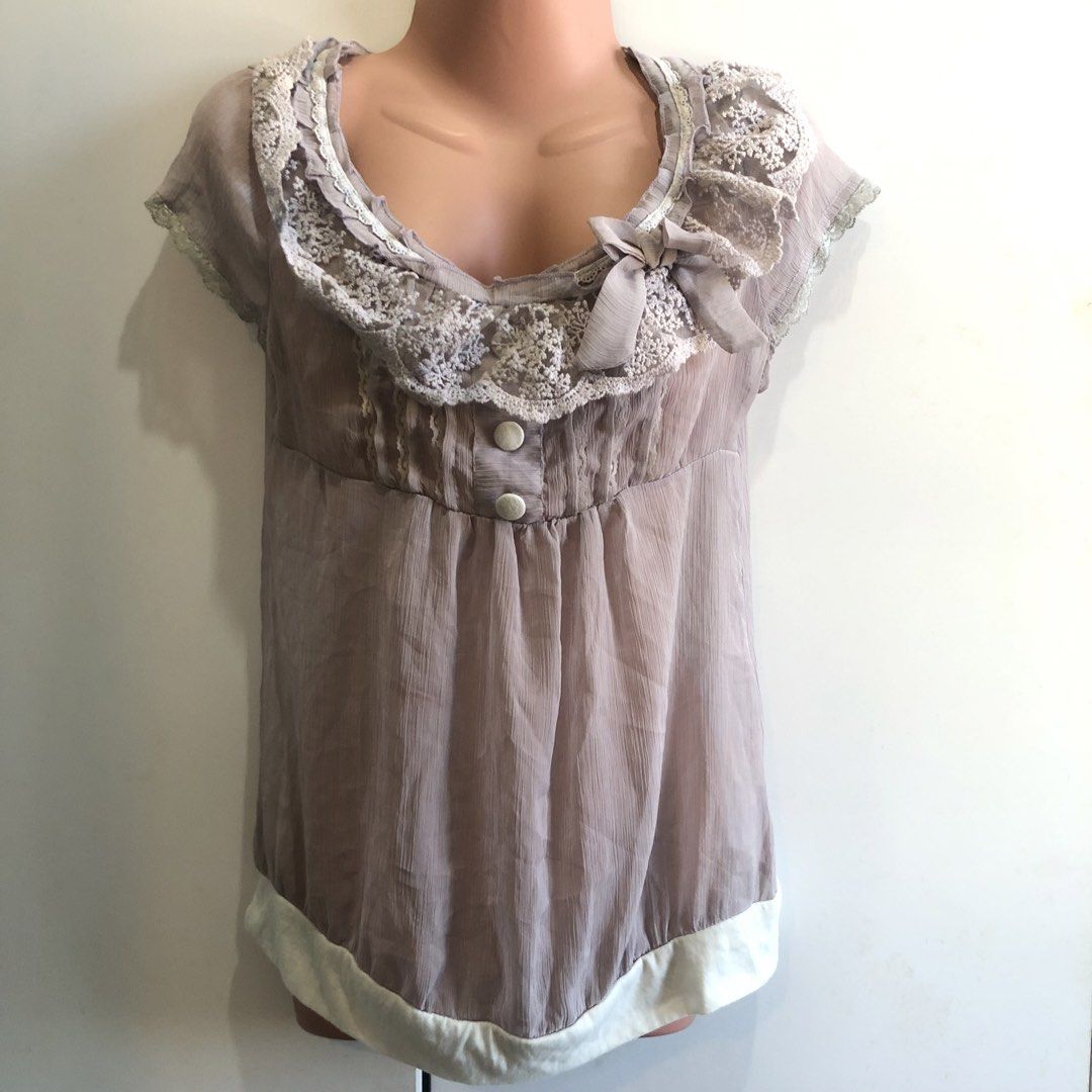 Fairycore Ruffles See through Lace Trimmed Blouse (Category: Blouses) located in San Pedro. Submitted by subtrop.asph (Listing ID 1437105914, Image 1). Description: Fits S-M - Delicate lace trim on neckline and sleeves - Charming bow detail on the front - Two button closure - Flowing, semi-sheer fabric - Contrasting white trim at the bottom - Soft, muted color.