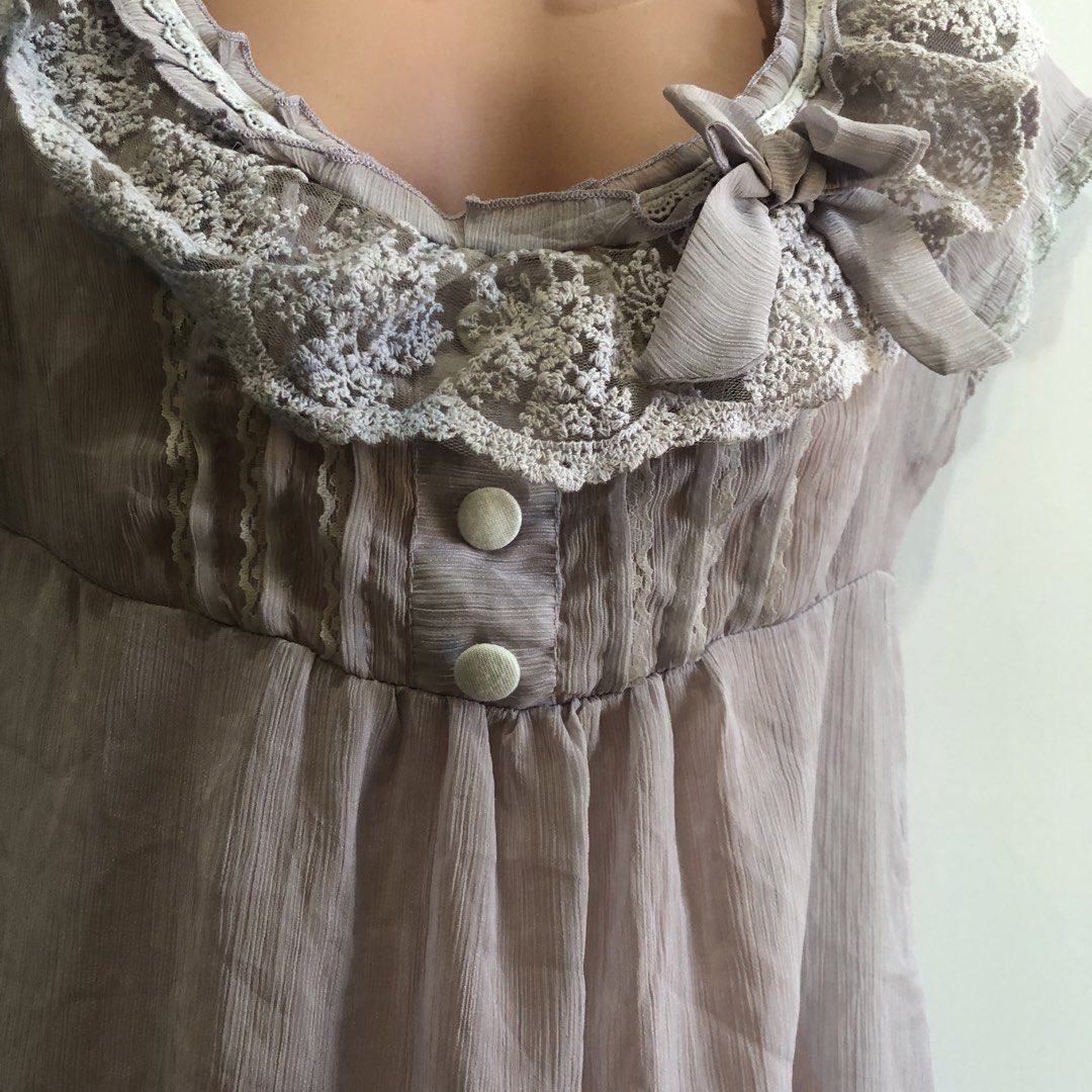 Fairycore Ruffles See through Lace Trimmed Blouse (Category: Blouses) located in San Pedro. Submitted by subtrop.asph (Listing ID 1437105914, Image 2). Description: Fits S-M - Delicate lace trim on neckline and sleeves - Charming bow detail on the front - Two button closure - Flowing, semi-sheer fabric - Contrasting white trim at the bottom - Soft, muted color.
