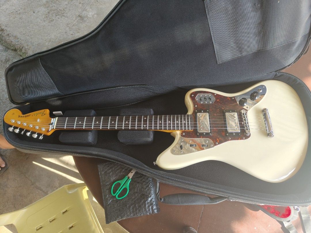 Fender Jaguar Special HH Electric Guitar (Category: Musical Instruments) located in Santiago. Submitted by lester_bolisay_09264655959 (Listing ID 1437156089, Image 2). Description: - Fender Jaguar electric guitar - Cream body with tortoiseshell pickguard - Two pickups - Tremolo system - Fender logo on headstock - Includes hard case - Made in Japan neck - We Accept Credit Card Payment.