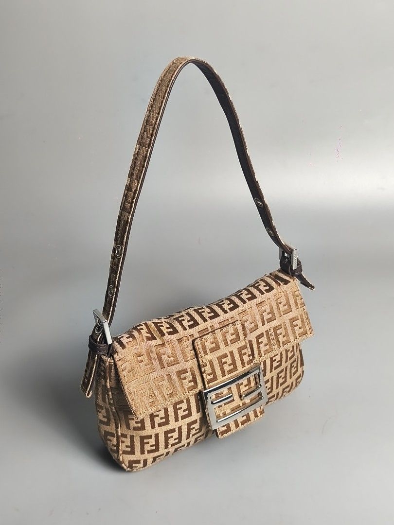 Fendi Zucchino Mini Baguette (Category: Luxury Bags & Wallets) located in Bulacan. Submitted by 4kcollection (Listing ID 1437078456, Image 2). Description: Fendi Zucchino Mini Baguette Pre-loved from Japan 🇯🇵 Very Good Condition Size: Small Ff Zipper No Code No Flaws No Inclusion Dm for sure buyer 📩 MOP: Gcash / Maya / BPI Courier: J&t / Lbc / Lalamove Location: SJDM Bulacan.
