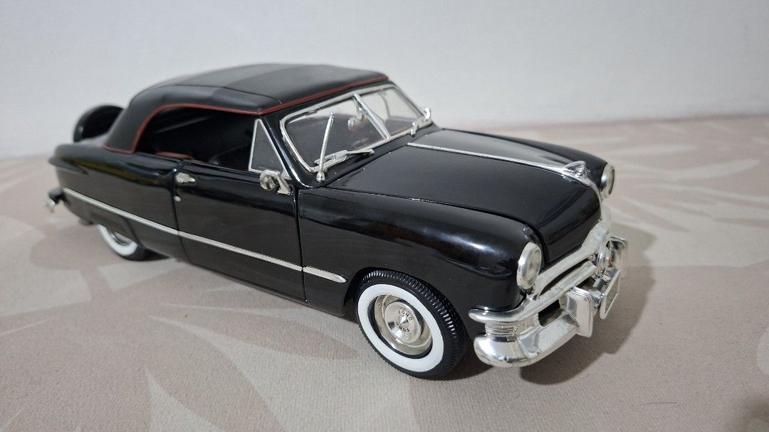 Ford 1950 Convertible Diecast Model, 1/18 scale (Category: Vehicle & Diecast Models) located in Imus. Submitted by pick_and_dig (Listing ID 1437201382, Image 1). Description: This is a 1:18 scale diecast model of a 1950 Ford Convertible by Maisto, featuring a black finish and functional parts. Model Details: The model is highly detailed with over 130 parts, including rubber tires and a detailed engine bay. Functional Features: It includes openabl