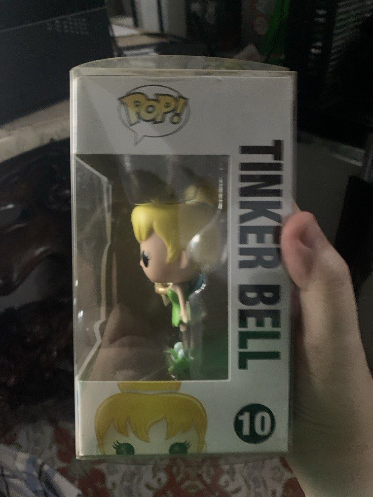 Funko Pop! Disney Tinker Bell #10 (Category: Designer & Blind Box Toys) located in Manila. Submitted by robertzombie (Listing ID 1437167350, Image 2). Description: - Funko Pop! figure of Tinker Bell - From Disney - Series 1, #10 - Includes original packaging - Box features Funko Pop! and Disney logos - Back of box shows other characters from the series 09153896941 f1.