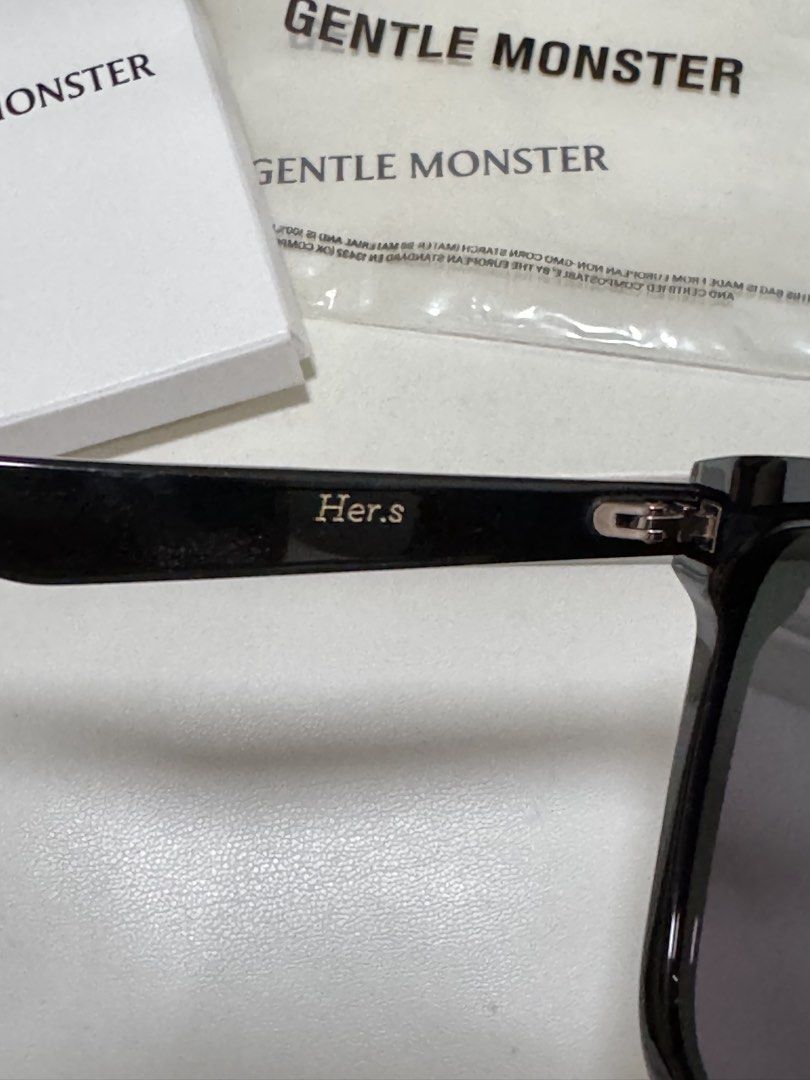 Gentle Monster Her.s-01 Sunglasses (Category: Sunglasses & Eyewear) located in Quezon City. Submitted by ekacloset (Listing ID 1437139886, Image 3). Description: - Authentic Gentle Monster Flatba Her sunglasses - Color: Black - Includes: - Original box - Case - Authenticity card - Cleaning cloth - Gentle Monster logo visible on temples and case.