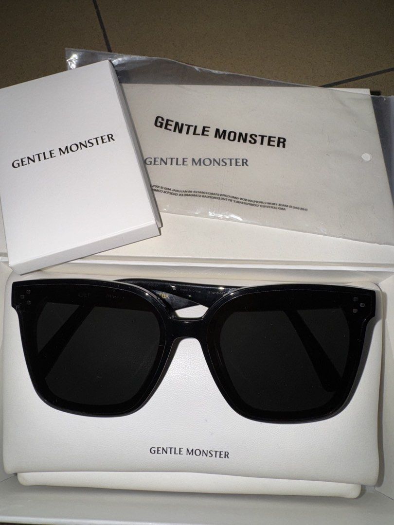 Gentle Monster Her.s-01 Sunglasses (Category: Sunglasses & Eyewear) located in Quezon City. Submitted by ekacloset (Listing ID 1437139886, Image 1). Description: - Authentic Gentle Monster Flatba Her sunglasses - Color: Black - Includes: - Original box - Case - Authenticity card - Cleaning cloth - Gentle Monster logo visible on temples and case.