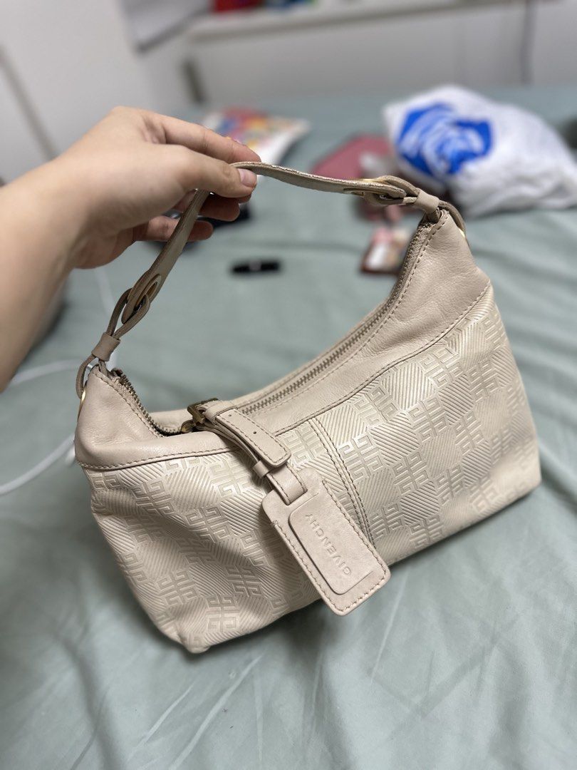 Givenchy kili kili Shoulder Bag (Category: Luxury Bags & Wallets) located in Quezon City. Submitted by mema0522 (Listing ID 1437145012, Image 1). Description: - Givenchy shoulder bag - Light beige color - Repeating pattern design - Zipper closure - Single shoulder strap - Gold-toned hardware - Includes leather Givenchy logo tag.