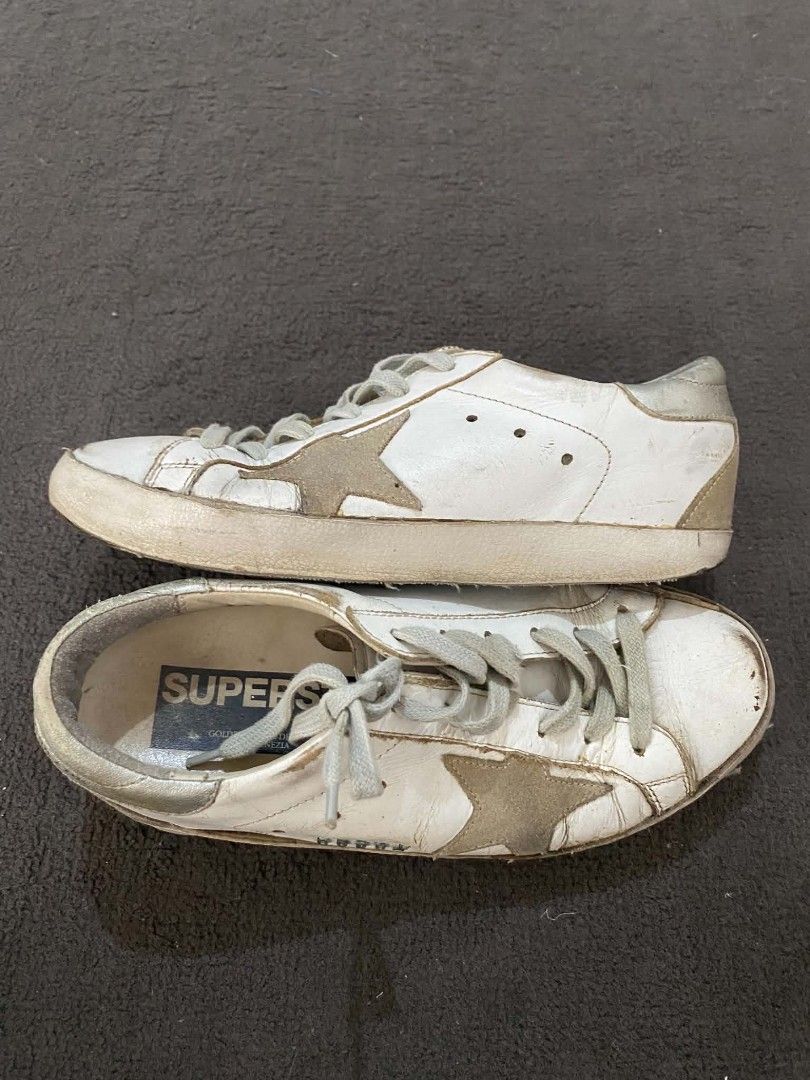 Golden Goose Superstar Sneakers (Category: Sneakers) located in Cagayan de Oro. Submitted by buchick1015 (Listing ID 1437046706, Image 3). Description: FS: Golden Goose Superstar sneakers - White with brown star detail - Grey laces - Distressed design - Black soles with chevron pattern has some sign of usages but still on good condition RFS: Decluttering Location: Uptown, CDO if outside cdo for shipping just add 100 for shipping fee...