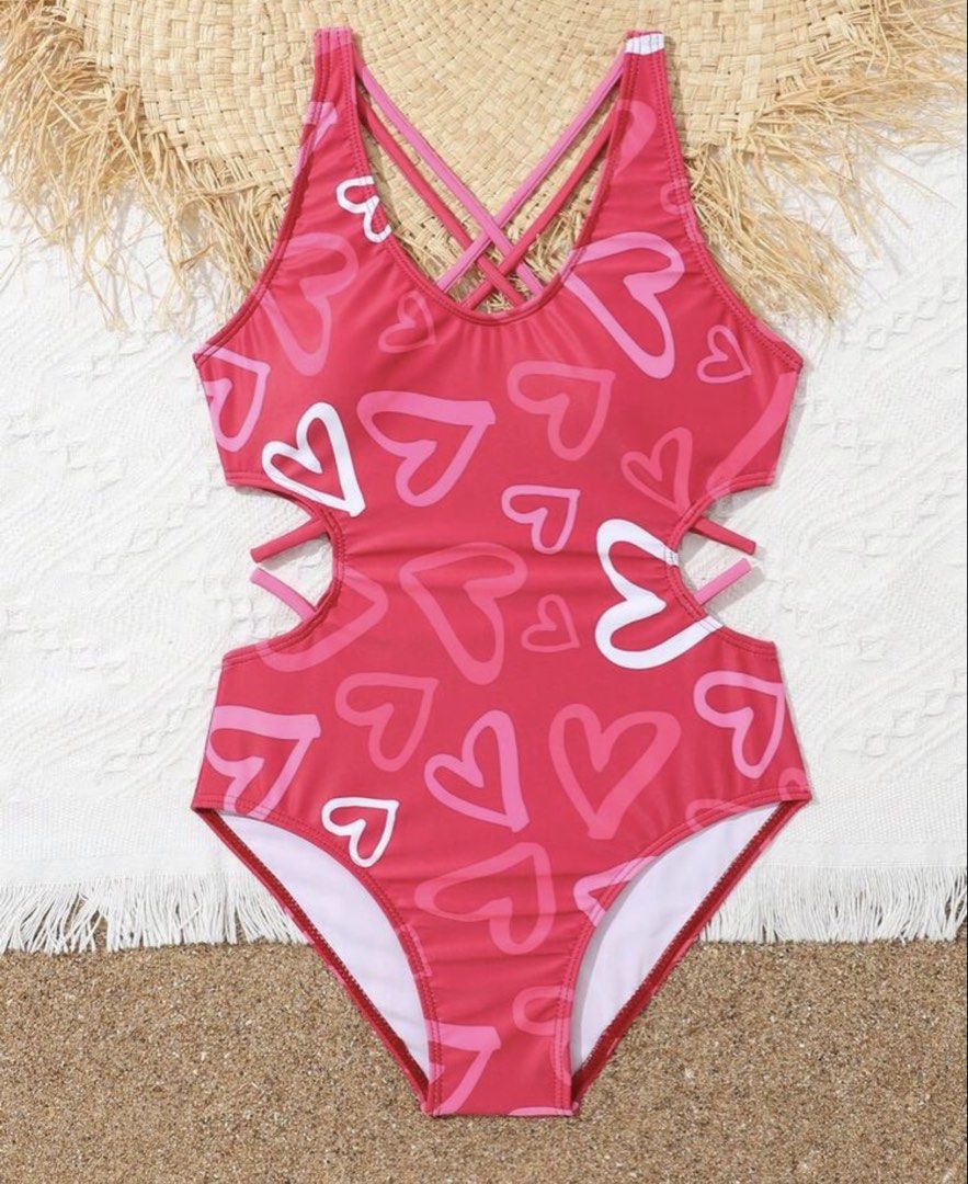 Heart Print Cutout Swimsuit (Category: Babies & Kids Fashion) located in Santo Tomas. Submitted by kylejao21 (Listing ID 1437078869, Image 1). Description: - Red one-piece swimsuit - Features a cute heart print - Stylish cutout detail on the sides - Criss-cross back design - Made from a smooth, stretchy material - Ideal for beach and pool activities.
