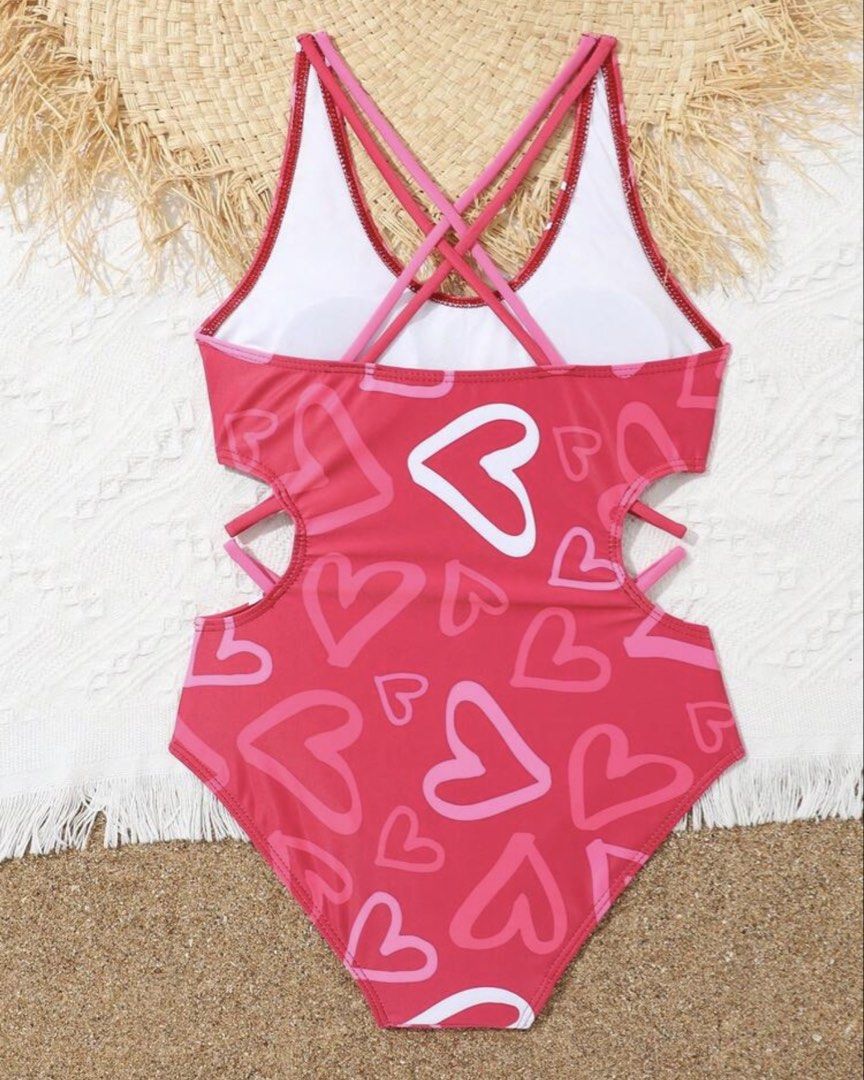 Heart Print Cutout Swimsuit (Category: Babies & Kids Fashion) located in Santo Tomas. Submitted by kylejao21 (Listing ID 1437078869, Image 2). Description: - Red one-piece swimsuit - Features a cute heart print - Stylish cutout detail on the sides - Criss-cross back design - Made from a smooth, stretchy material - Ideal for beach and pool activities.