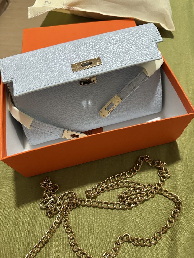 Hermes Kelly To Go Wallet (Category: Luxury Bags & Wallets) located in Navotas City. Submitted by lexituscano (Listing ID 1437067894, Image 2). Description: - Authentic Hermes Kelly To Go Wallet - Light blue color - Gold chain strap and hardware - Multiple compartments and zipper pocket - Includes original box - Made in France.