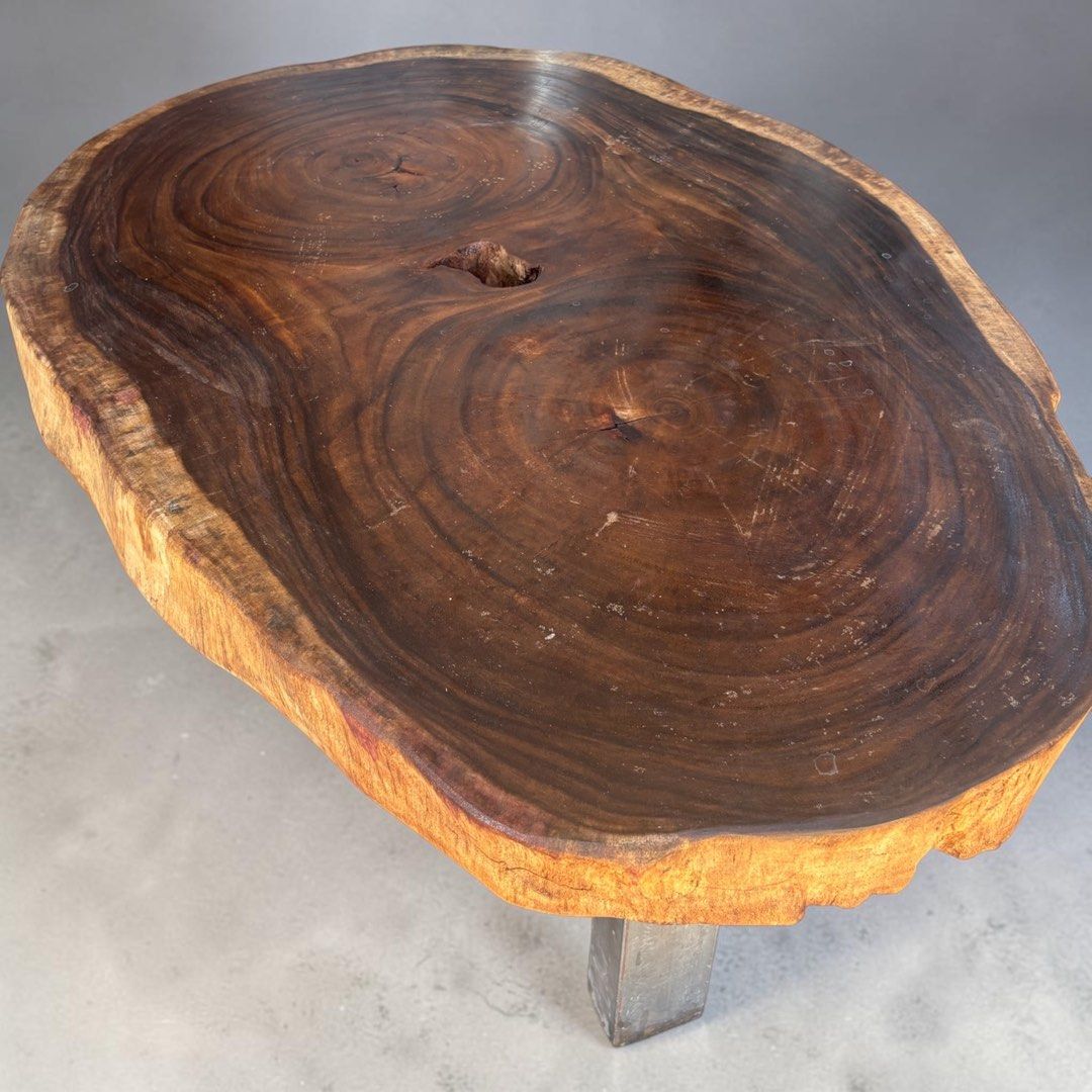 Huge Coffee table using Live Edge Wooden Top (Category: Tables & Sets) located in Pasig City. Submitted by casambhomedecors (Listing ID 1437208557, Image 1). Description: - Live edge wooden table - Approximately 1 meter long - 75 cm wide - Features a natural edge - Rich, dark wood grain - Supported by metal legs - Ideal for living rooms or accent pieces.