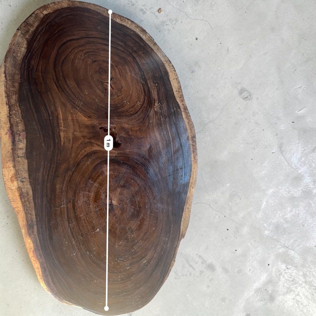 Huge Coffee table using Live Edge Wooden Top (Category: Tables & Sets) located in Pasig City. Submitted by casambhomedecors (Listing ID 1437208557, Image 2). Description: - Live edge wooden table - Approximately 1 meter long - 75 cm wide - Features a natural edge - Rich, dark wood grain - Supported by metal legs - Ideal for living rooms or accent pieces.