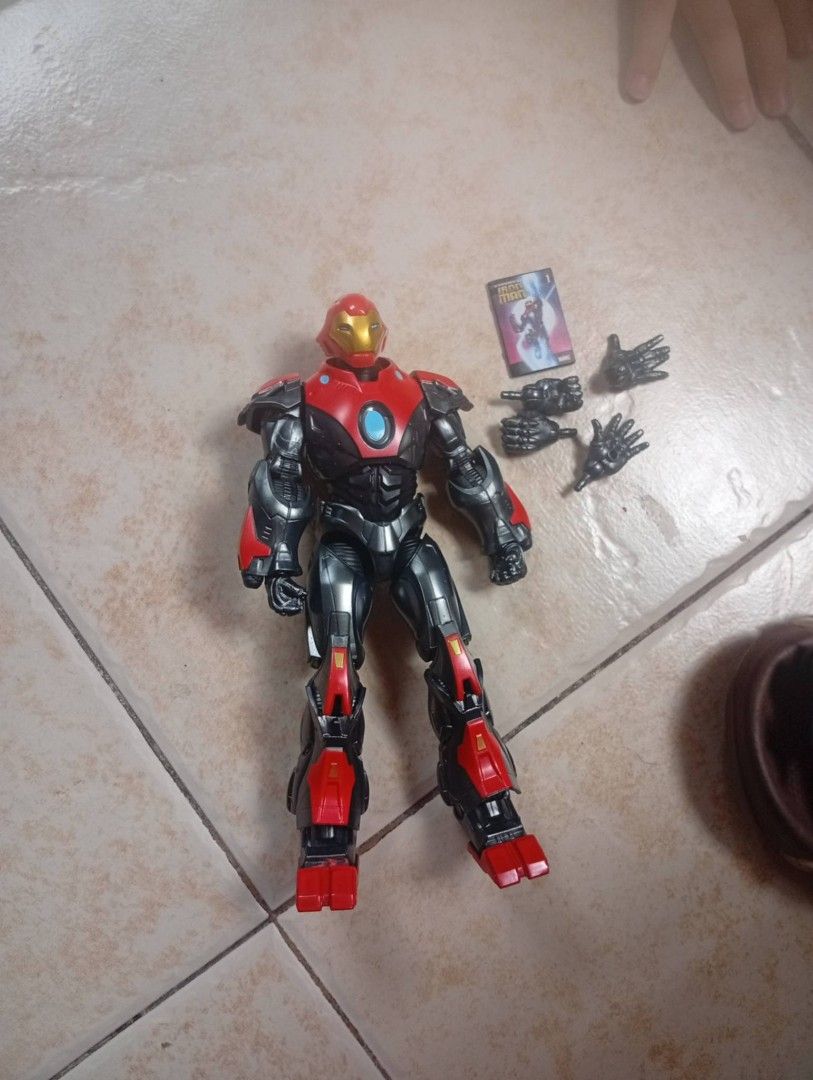 Iron Man Action Figure with Accessories (Category: Action & Battle Toys) located in Manila. Submitted by morbidz1717 (Listing ID 1437062774, Image 1). Description: Iron Man action figure with interchangeable hands and character card. Features red, black, and silver colors. Includes original accessories..