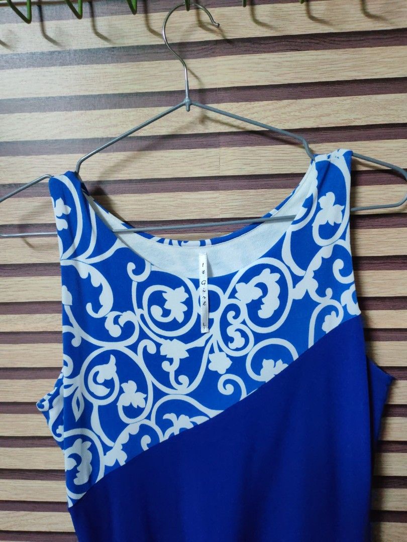It Girl Blue and White Patterned Dress (Category: Dresses) located in Makati City. Submitted by mybentables (Listing ID 1437159142, Image 2). Description: - Blue and white patterned dress - Unique design with solid blue front panel - Sleeveless - Comfortable fit - Size L - Perfect for casual or beach outings.