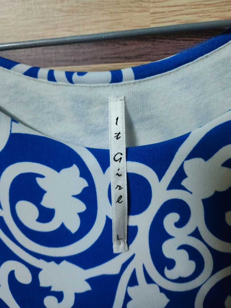 It Girl Blue and White Patterned Dress (Category: Dresses) located in Makati City. Submitted by mybentables (Listing ID 1437159142, Image 3). Description: - Blue and white patterned dress - Unique design with solid blue front panel - Sleeveless - Comfortable fit - Size L - Perfect for casual or beach outings.