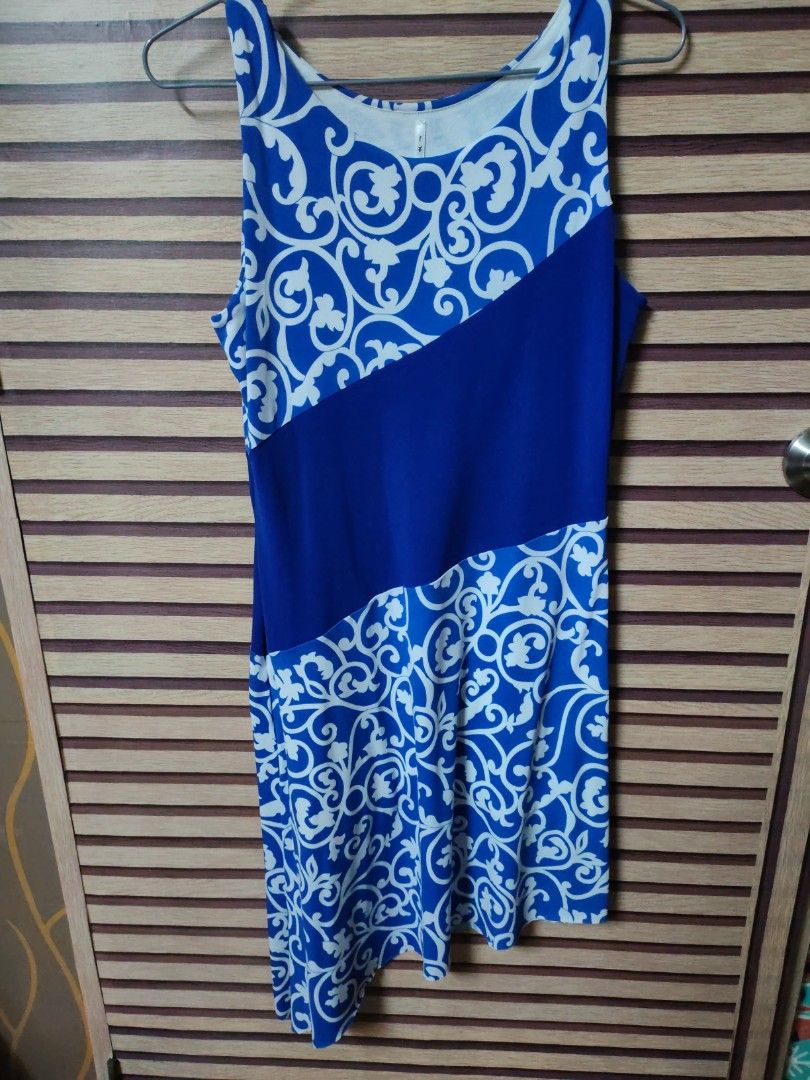It Girl Blue and White Patterned Dress (Category: Dresses) located in Makati City. Submitted by mybentables (Listing ID 1437159142, Image 1). Description: - Blue and white patterned dress - Unique design with solid blue front panel - Sleeveless - Comfortable fit - Size L - Perfect for casual or beach outings.