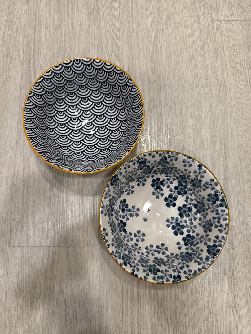Japanese Ceramic Bowls Set (Category: Dinnerware & Cutlery) located in Kuala Lumpur. Submitted by tan8783 (Listing ID 1437029696, Image 1). Description: - Set of two Japanese ceramic bowls. - One bowl: Blue wave pattern. - Other bowl: Blue floral design. - White interior for both. - Elegant gold rim. - Standard size, perfect for serving. - Clean and ready to use..