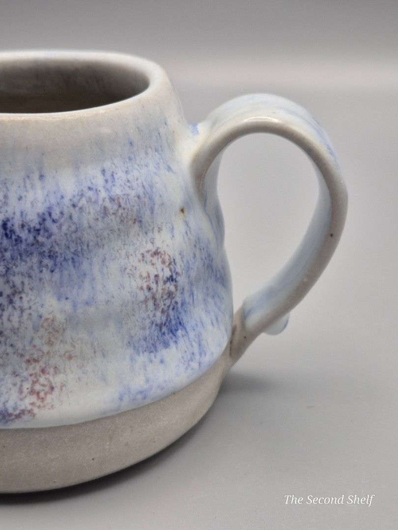 Japanese Handmade Ceramic Creamer / Small Pitcher (Category: Food Organization & Storage) located in Santa Rosa. Submitted by thesecondshelf (Listing ID 1437161328, Image 3). Description: Japanese Handmade Ceramic Creamer / Small Pitcher ₱300 Details: • Handmade ceramic creamer or small pouring pitcher • Soft white glaze with blue and earthy speckled finish • Rustic stoneware base • Functional handle and pouring spout • Great for milk, sauces, sy