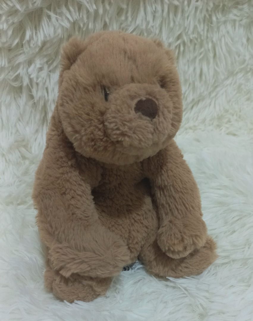 Jellycat Brown Teddy Bear Plush Toy (Category: Plushies & Soft Toys) located in Taguig. Submitted by phlercollections (Listing ID 1437140223, Image 1). Description: - Cute brown teddy bear design. - Soft and cuddly plush material. - Classic teddy bear features: round head, small ears, cute nose. - Ideal gift for kids and teddy bear lovers..