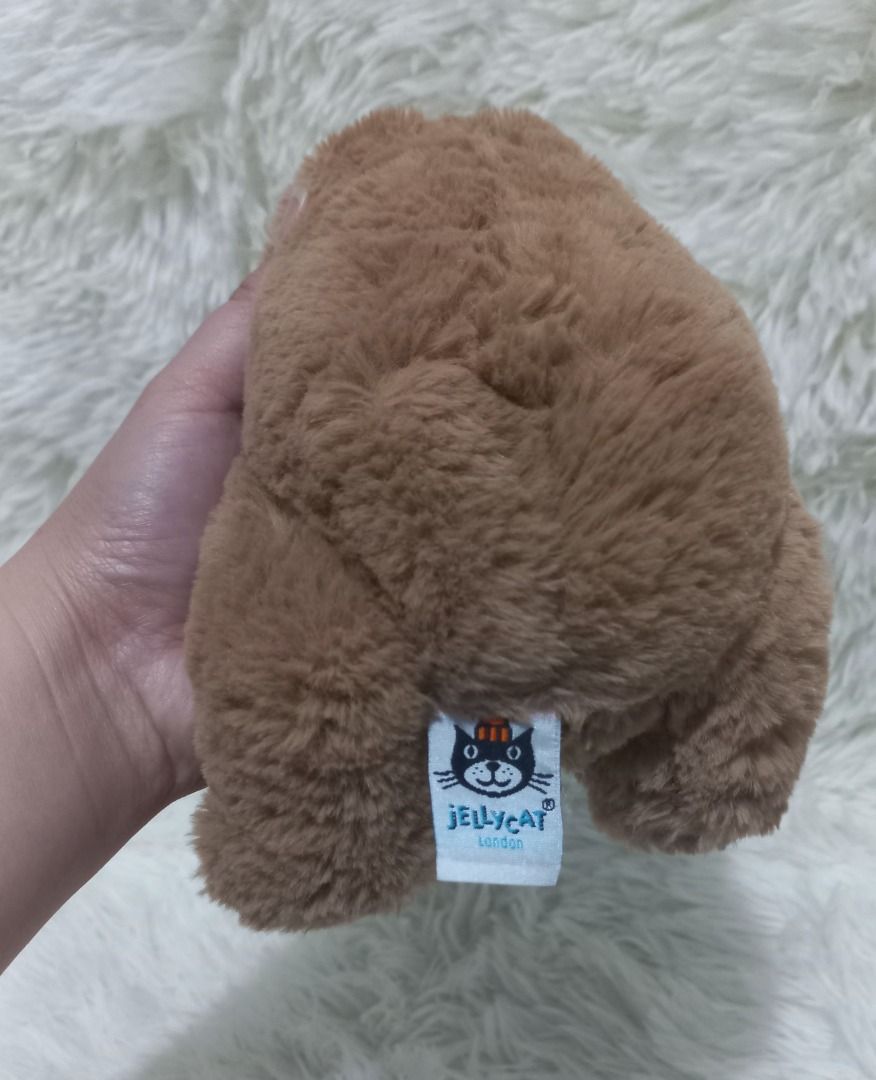 Jellycat Brown Teddy Bear Plush Toy (Category: Plushies & Soft Toys) located in Taguig. Submitted by phlercollections (Listing ID 1437140223, Image 3). Description: - Cute brown teddy bear design. - Soft and cuddly plush material. - Classic teddy bear features: round head, small ears, cute nose. - Ideal gift for kids and teddy bear lovers..