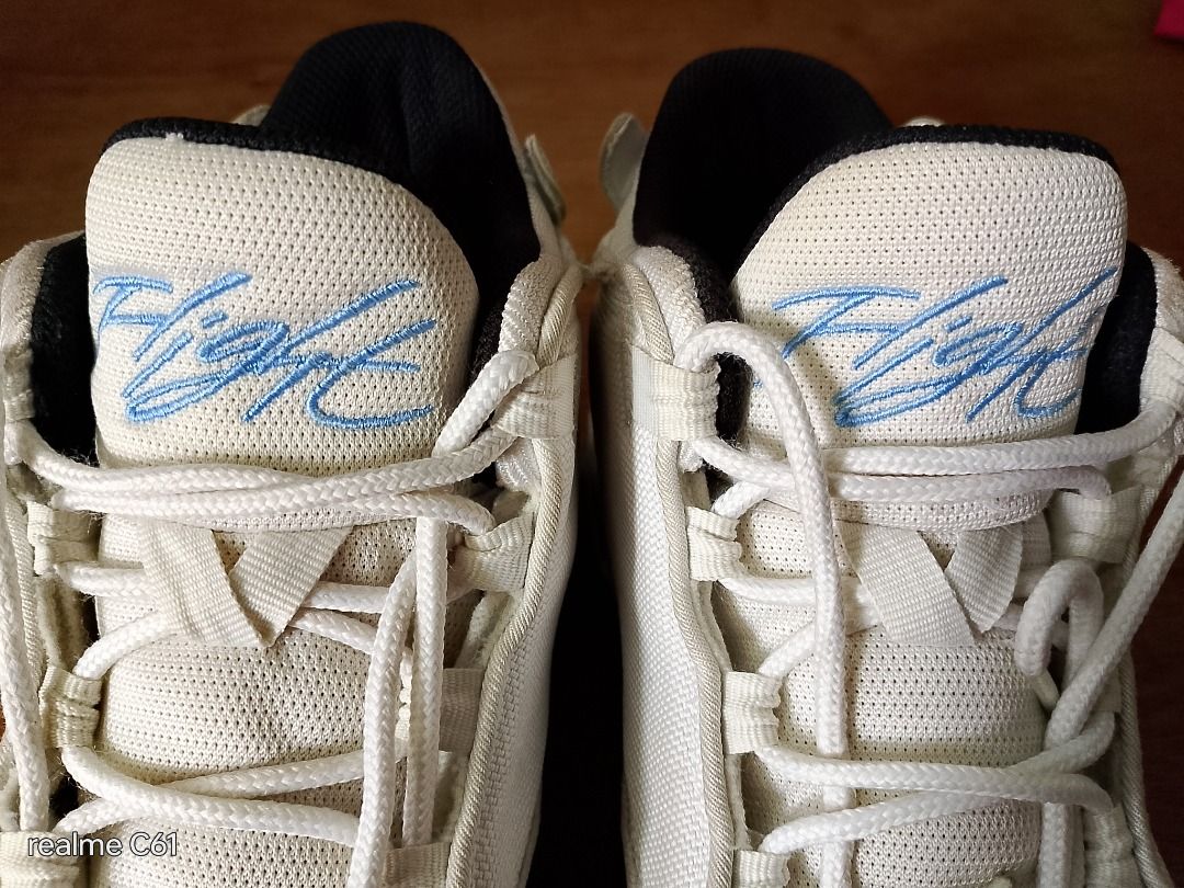 Jordan Flight Sneakers (Category: Sneakers) located in Caloocan City. Submitted by donflorald57310 (Listing ID 1437083642, Image 1). Description: - White Jordan Flight sneakers - White upper with blue "Flight" script - High-top design - Black inner lining - White soles with green accents.