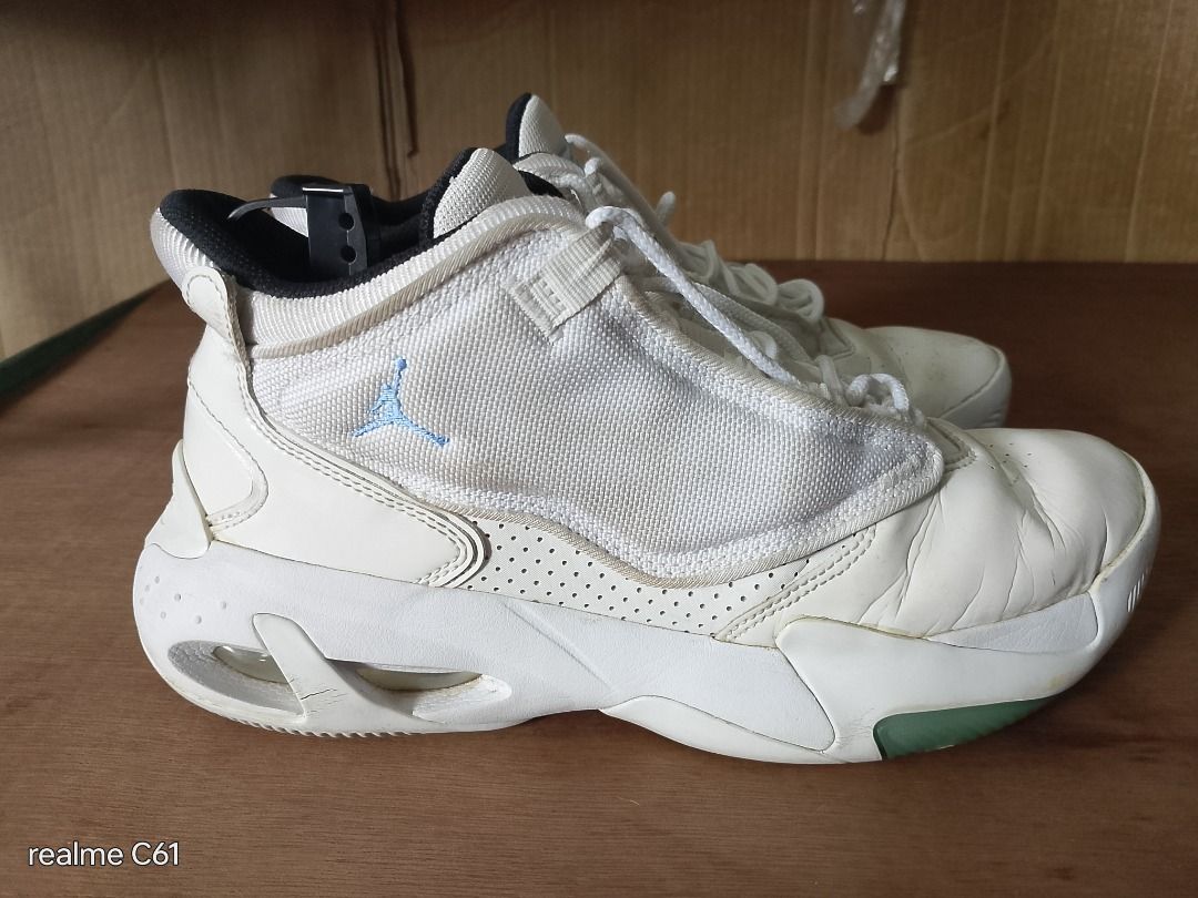 Jordan Flight Sneakers (Category: Sneakers) located in Caloocan City. Submitted by donflorald57310 (Listing ID 1437083642, Image 3). Description: - White Jordan Flight sneakers - White upper with blue "Flight" script - High-top design - Black inner lining - White soles with green accents.