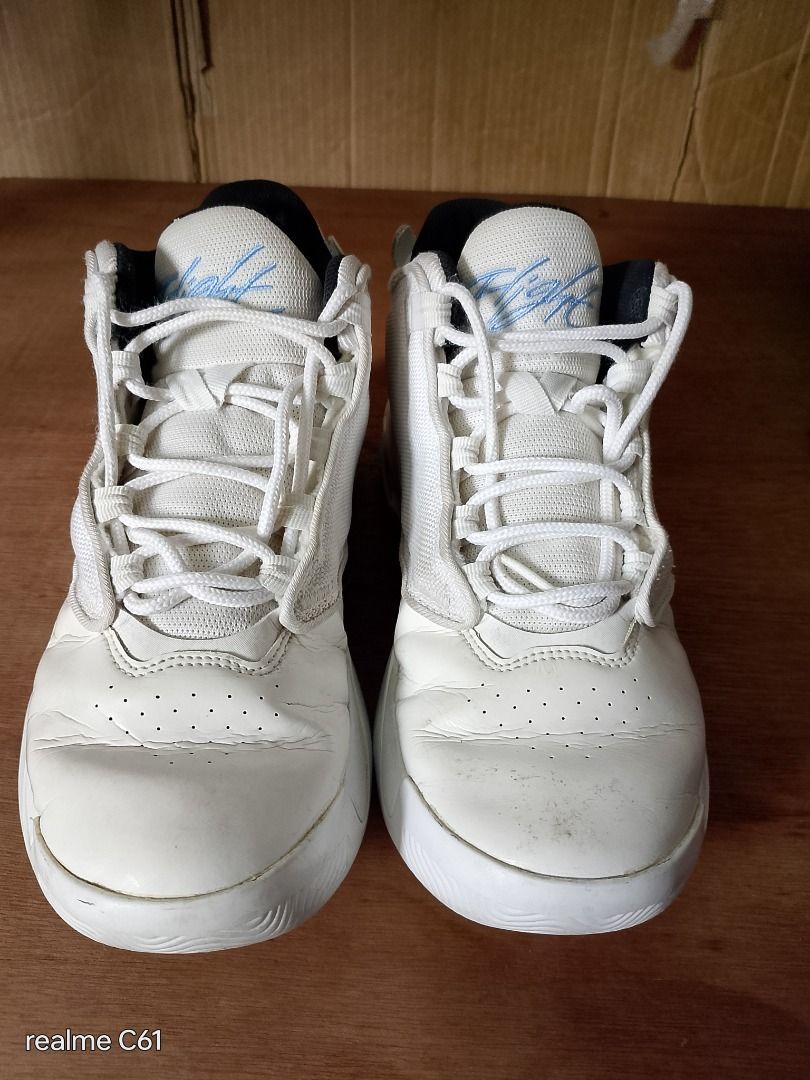 Jordan Flight Sneakers (Category: Sneakers) located in Caloocan City. Submitted by donflorald57310 (Listing ID 1437083642, Image 2). Description: - White Jordan Flight sneakers - White upper with blue "Flight" script - High-top design - Black inner lining - White soles with green accents.