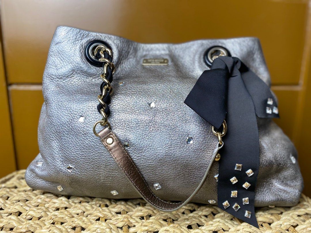 Kate Spade Metallic Gray/Silver Big Bow Tote (Category: Luxury Bags & Wallets) located in Taytay. Submitted by thepearllabph (Listing ID 1437143365, Image 2). Description: KATE SPADE Metallic Pebbled Leather Chain Tote Handbag Price: 4,000php Stunning and flashy. Hard to come by . Unique with durable leather. Nice black bow and ribbon chain. *Appearance 8.5/10 Color: Silver Model/Circa: Material: leather Pattern: plain Size: large Origin: Lining: