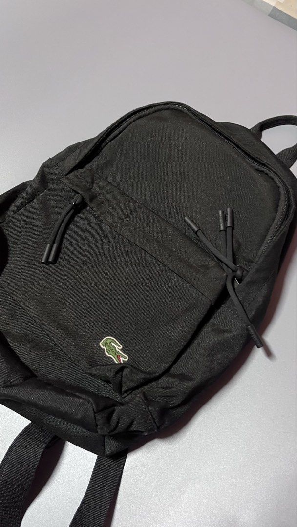 LACOSTE BAG (Category: Backpacks) located in Cebu City. Submitted by markmeta213 (Listing ID 1437031163, Image 3). Description: AUTHENTIC BACKPACK EXCELLENT CONDITION RFS: SMALL FOR ME.