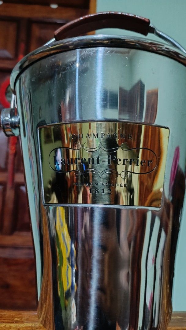 Laurent-Perrier Champagne Ice Bucket (Category: Other Kitchenware & Tableware) located in Taguig. Submitted by redarmy21775000 (Listing ID 1437154527, Image 2). Description: - Laurent-Perrier ice bucket - Stainless steel body - Brown leather handle with embossed brand name - Gold-colored label - Perfect for champagne and other beverages - Classic design.