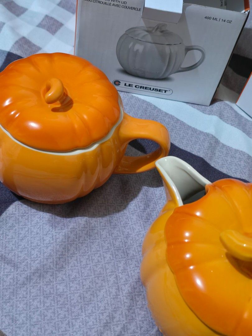 Le Creuset Mug and Gravy Pot Set (Category: Coffee & Tea Tableware) located in Marikina City. Submitted by concuorebianco (Listing ID 1437115087, Image 2). Description: - Brand new Le Creuset mug and gravy pot - Eye-catching orange color - Adorable pumpkin shape - Includes lid with stem-shaped handle - Convenient pouring spout - 400 ml / 14 oz capacity - Comes with original box.